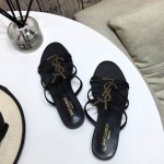 YSL Cassandra Flat Sandals in Patent Leather Black / Gold