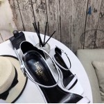 YSL opyum sandals in patent leather with black heel white